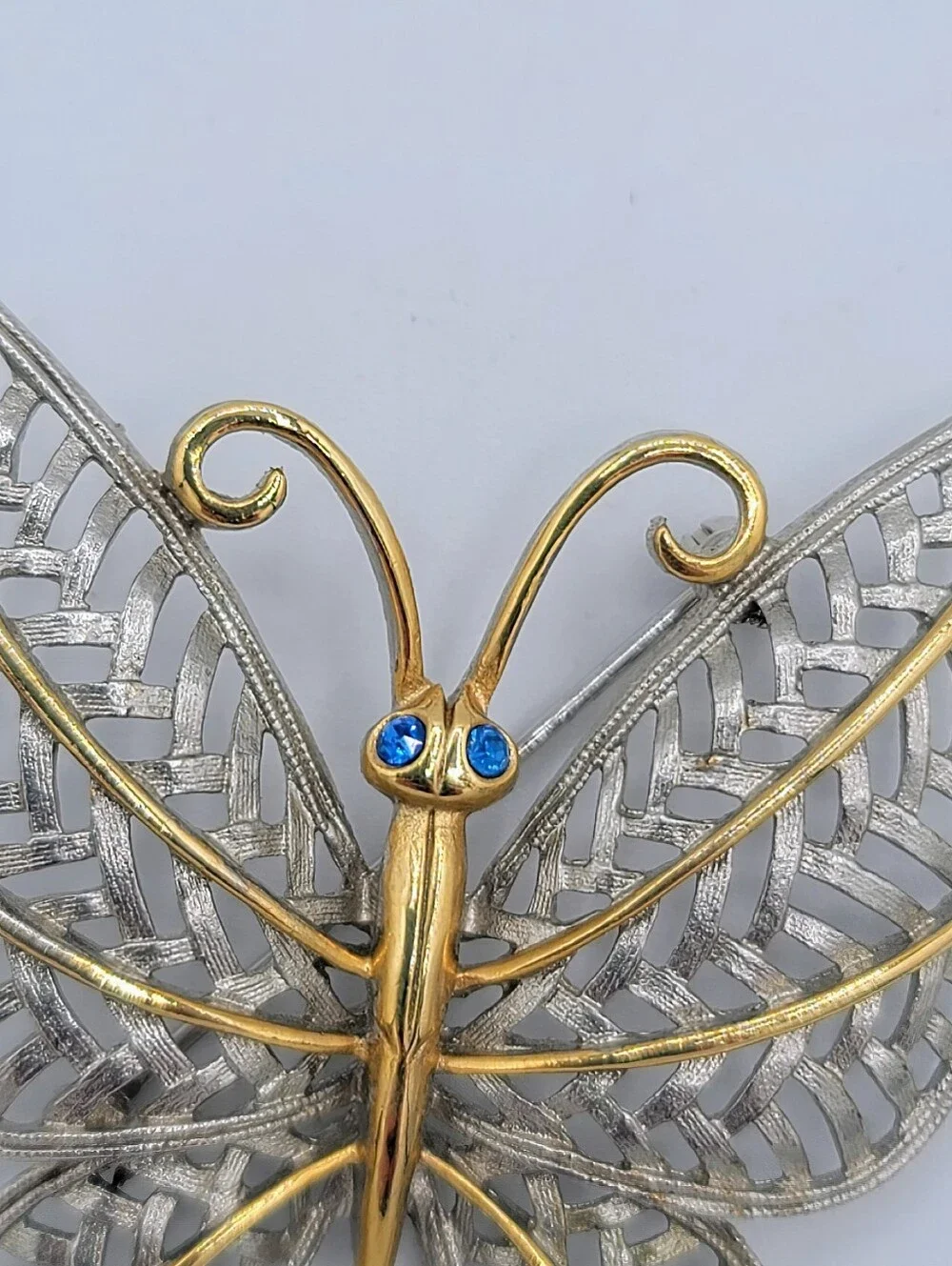 Avon Butterfly Brooch Two Tone Gold Silver Openwork Blue Rhinestone Eyes Vintage